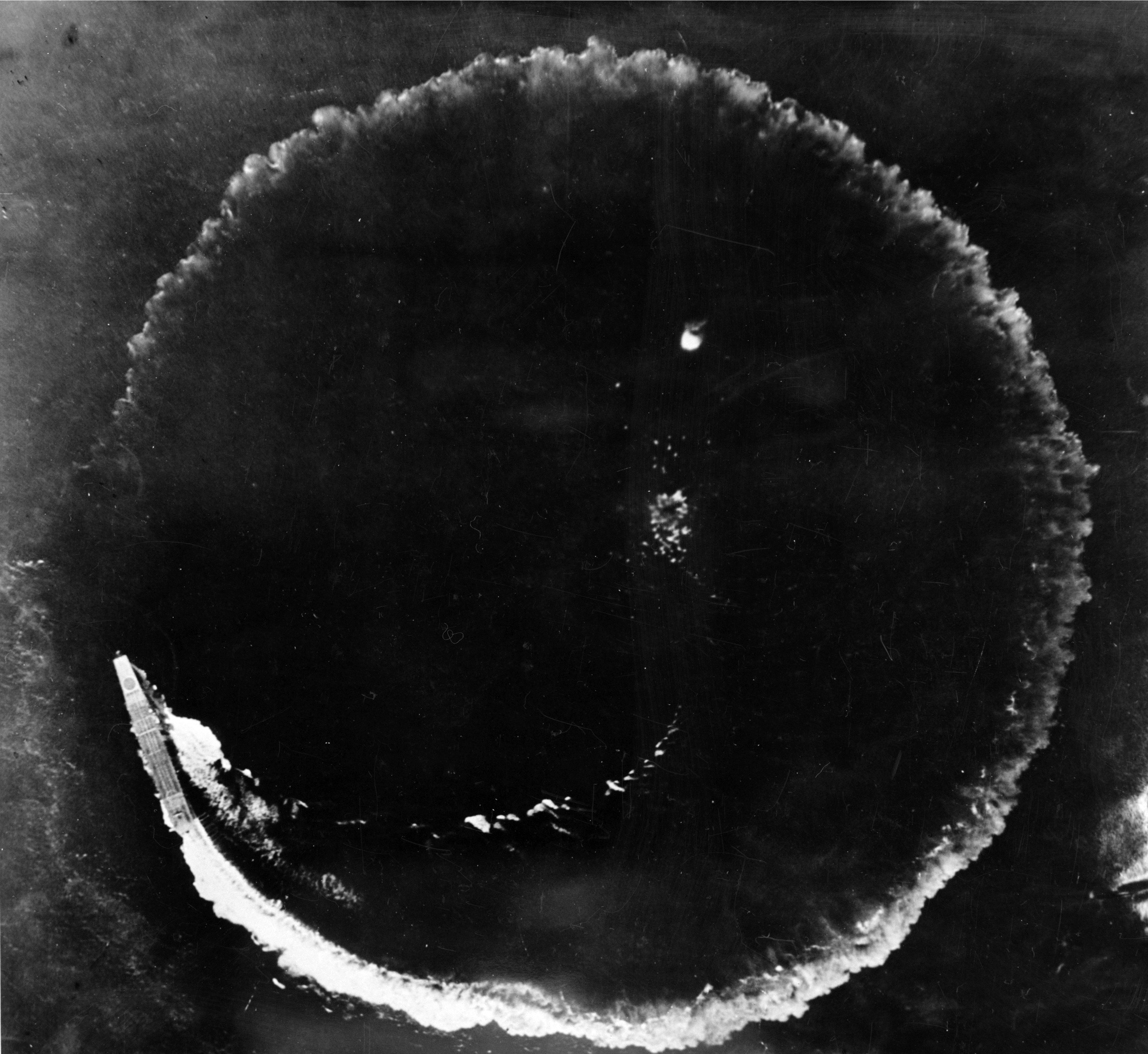 Aerial view of the Japanese aircraft carrier Sōryū evading an air attack during the Battle of Midway, 1942